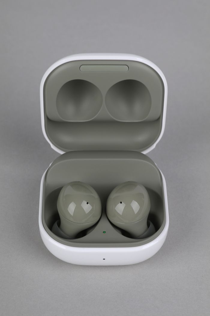 Crafting Captivating Headlines: Your awesome post title goes here Close-up of wireless earbuds placed in an open charging case against a gray background, highlighting modern technology.